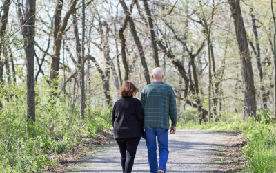 Older couple walking on forest road