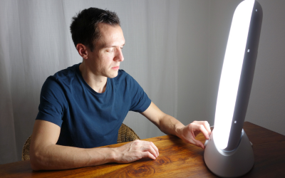 Man in front of therapy lamp