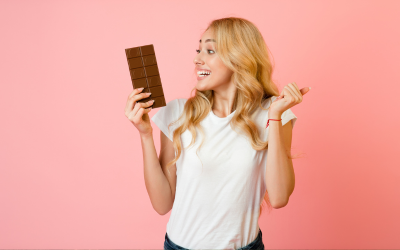 Woman happily holding chocolate