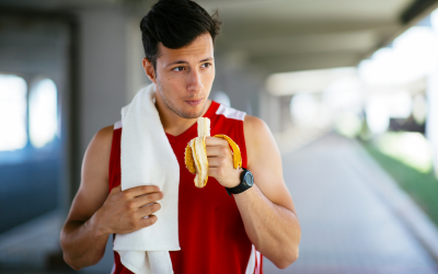 Man eating a banana after a workout